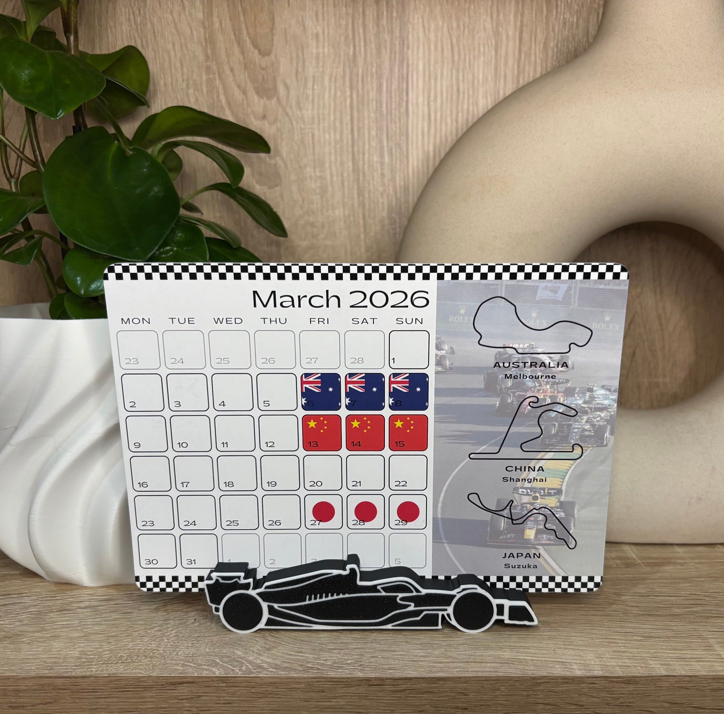 2026 F1 desk calendar showing race weekends with national flags